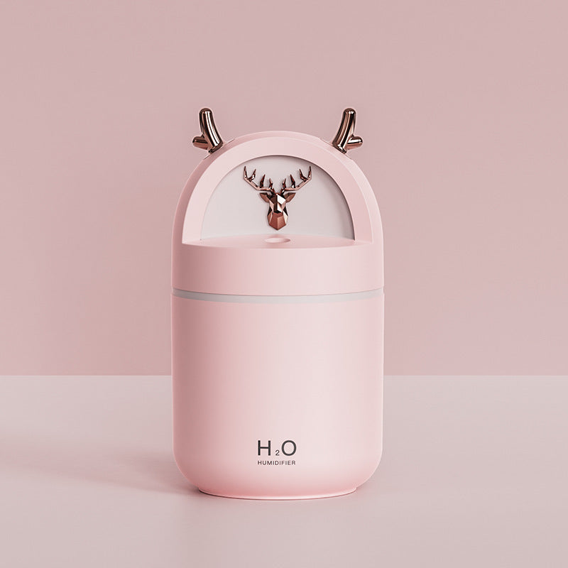 Yilu Has You Cute Pet Deer Mini Humidifier Usb in pink with deer design and antlers on top.